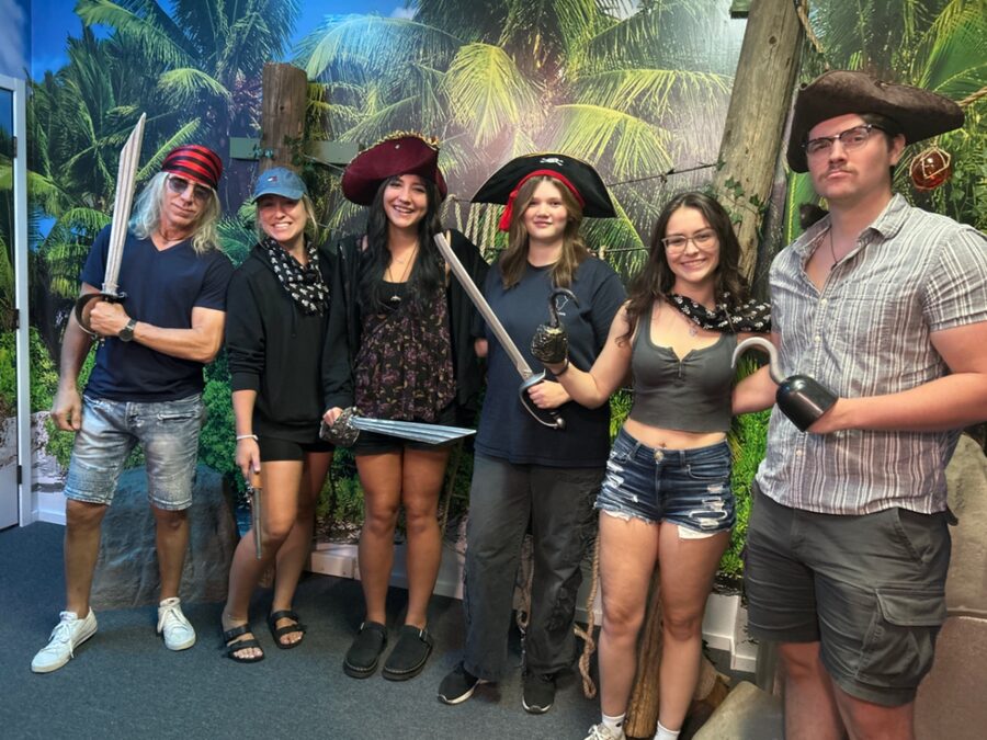 Pirate crew with swords after winning Scallywags