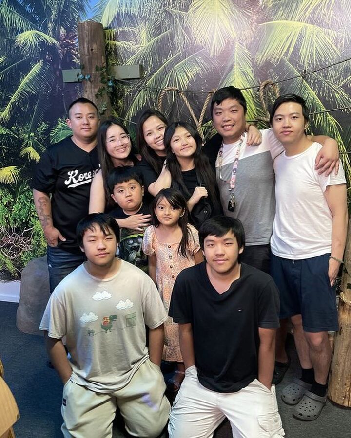 Large family group celebrating their escape